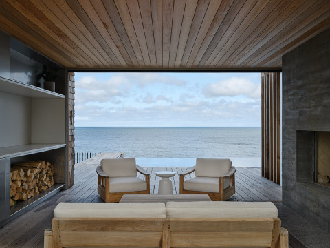 View of pool/ocean from covered patio